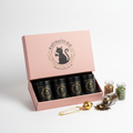 Kaffinated Kat Loose Leaf Tea Sampler pink box with 4 tea blends and black gold logo
